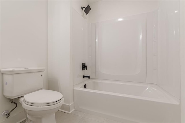 4075 O Henry Ct, Mcdonough, GA 30252 - bathroom featuring tile patterned floors, toilet, shower / washtub combination, and baseboards