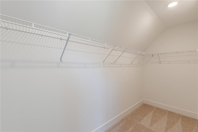 4075 O Henry Ct, Mcdonough, GA 30252 - spacious closet featuring light carpet and vaulted ceiling