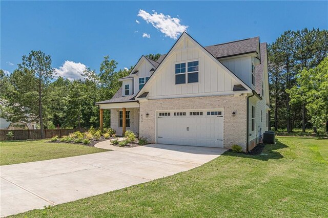 4075 O Henry Ct, Mcdonough, GA 30252 - craftsman inspired home with board and batten siding, concrete driveway, central air condition unit, brick siding, and a shingled roof