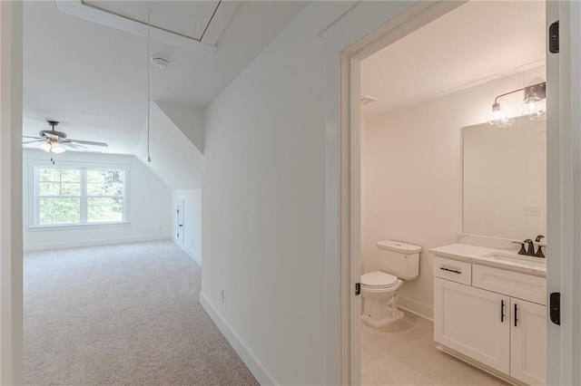 4075 O Henry Ct, Mcdonough, GA 30252 - bathroom featuring toilet, vanity, baseboards, and vaulted ceiling