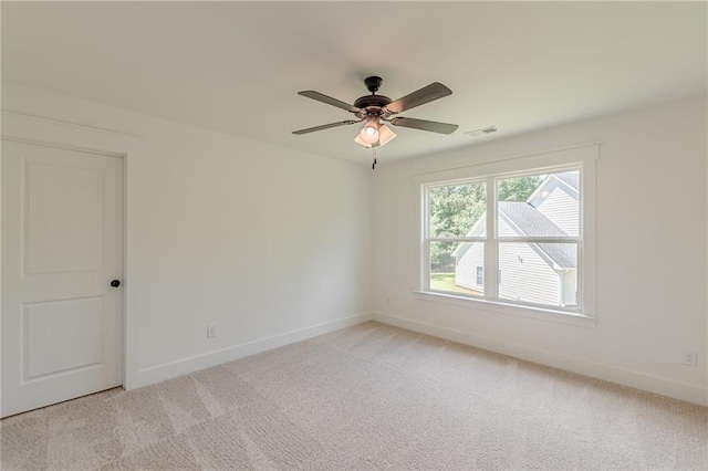 4075 O Henry Ct, Mcdonough, GA 30252 - spare room featuring light colored carpet, baseboards, and a ceiling fan