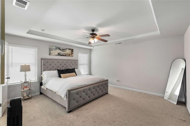 3406 Pennington Dr, Lithonia, GA 30038 - carpeted bedroom with a raised ceiling, baseboards, and ceiling fan