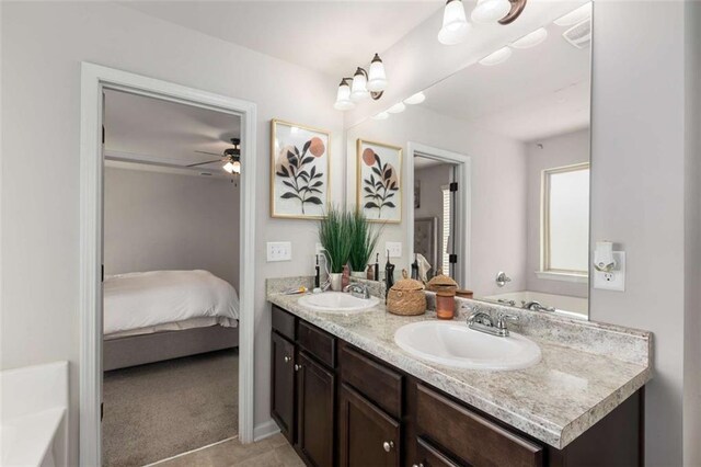 3406 Pennington Dr, Lithonia, GA 30038 - ensuite bathroom featuring double vanity, a ceiling fan, and a tub