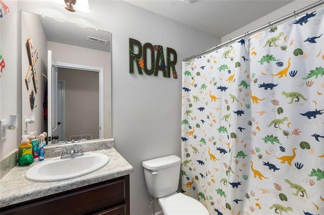 3406 Pennington Dr, Lithonia, GA 30038 - bathroom featuring toilet, vanity, and a shower with curtain