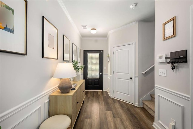 3406 Pennington Dr, Lithonia, GA 30038 - foyer featuring dark wood finished floors, ornamental molding, and stairway