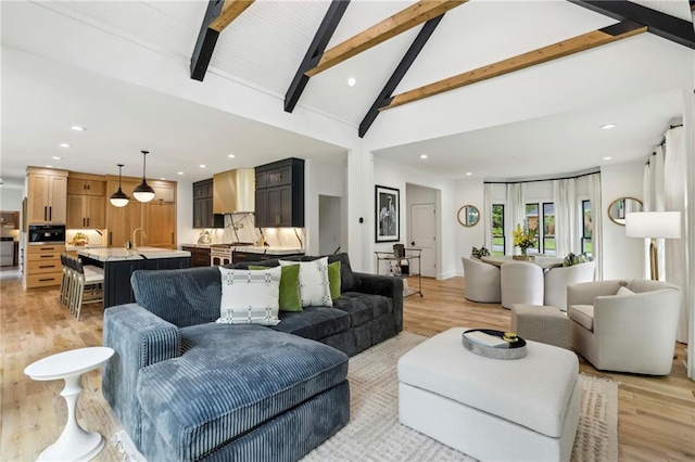 living room featuring light wood-type flooring, beam ceiling, recessed lighting, and high vaulted ceiling