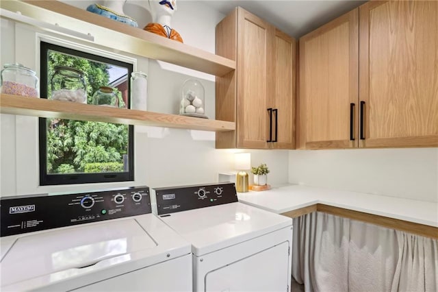 laundry area with cabinet space and washing machine and dryer