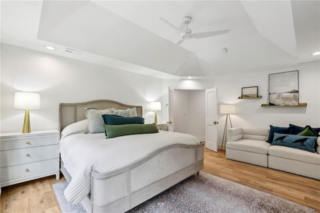 bedroom with recessed lighting, ceiling fan, and wood finished floors