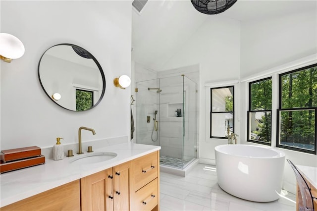 full bath featuring vanity, a stall shower, a soaking tub, and high vaulted ceiling