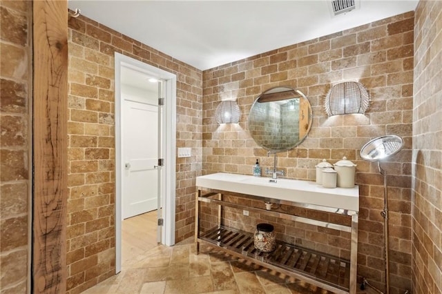 bathroom with stone finish flooring