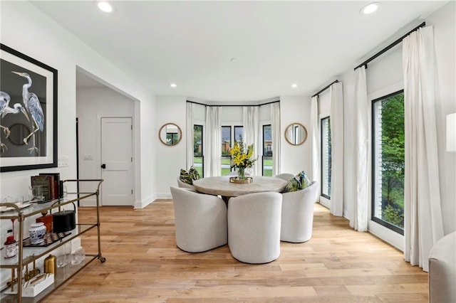 dining area with light wood-style flooring, recessed lighting, and baseboards