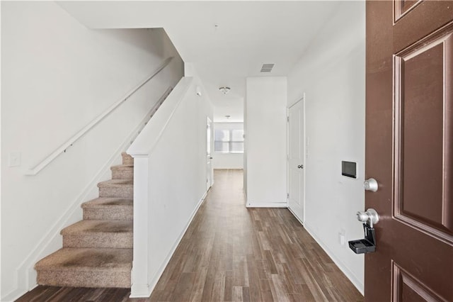 foyer with dark hardwood / wood-style flooring