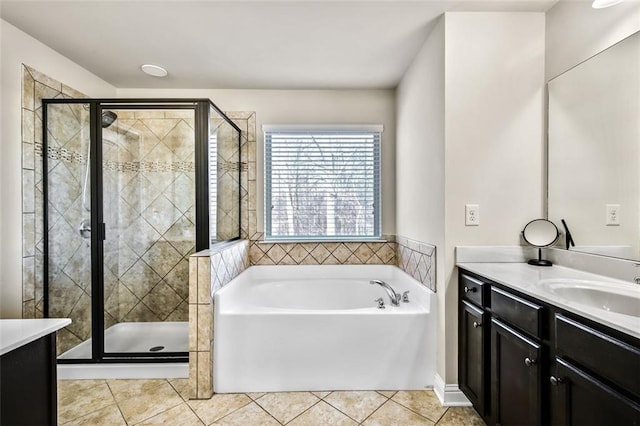 bathroom with vanity, tile patterned flooring, and independent shower and bath