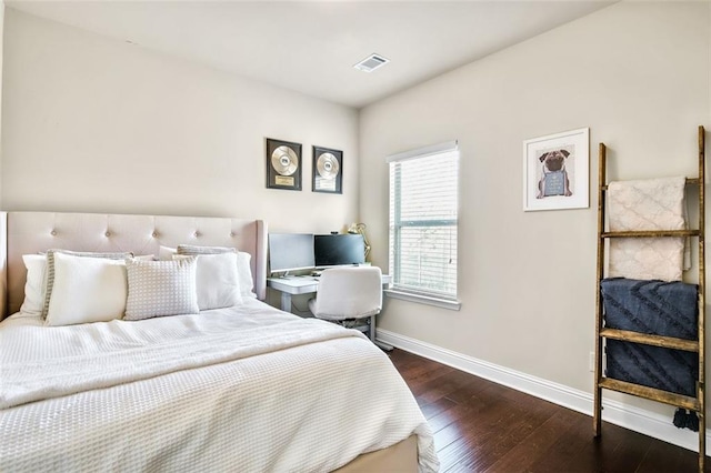 bedroom featuring dark hardwood / wood-style floors