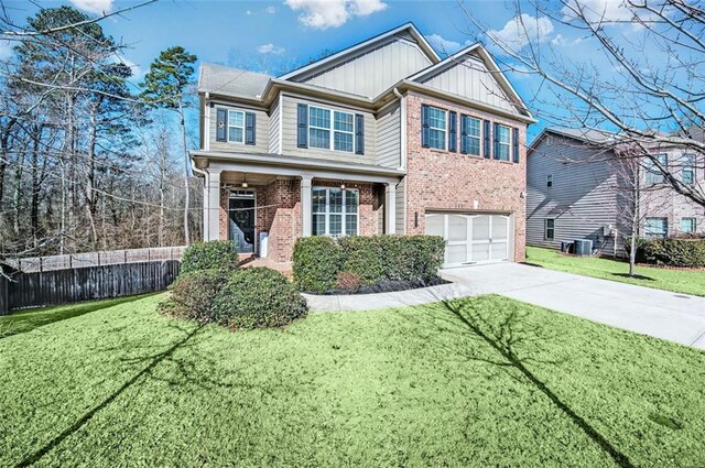 view of front facade featuring a front yard and a garage