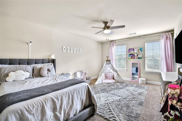 carpeted bedroom with ceiling fan