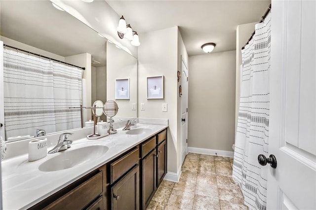 bathroom featuring curtained shower and vanity