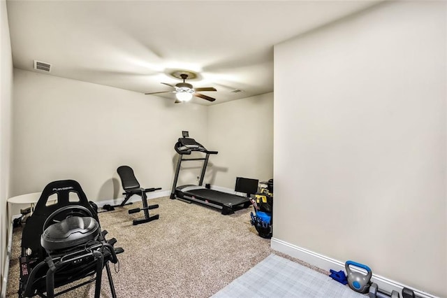 workout area with ceiling fan and carpet floors