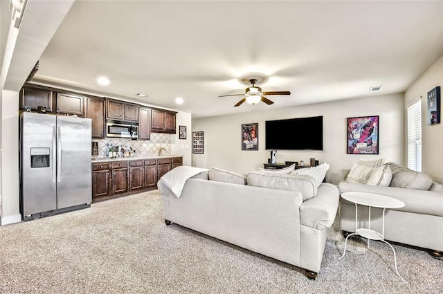 living room with ceiling fan