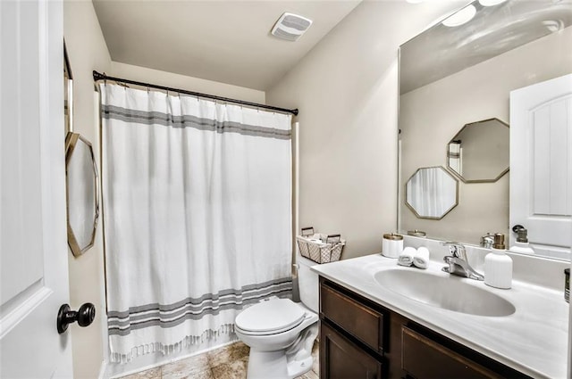 full bathroom featuring toilet, shower / tub combo, and vanity