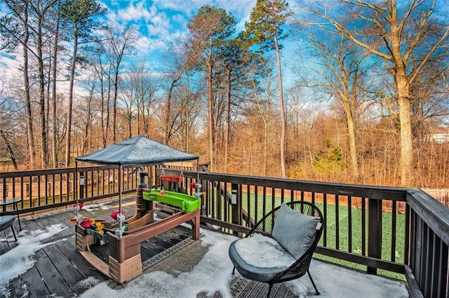 wooden terrace with a yard