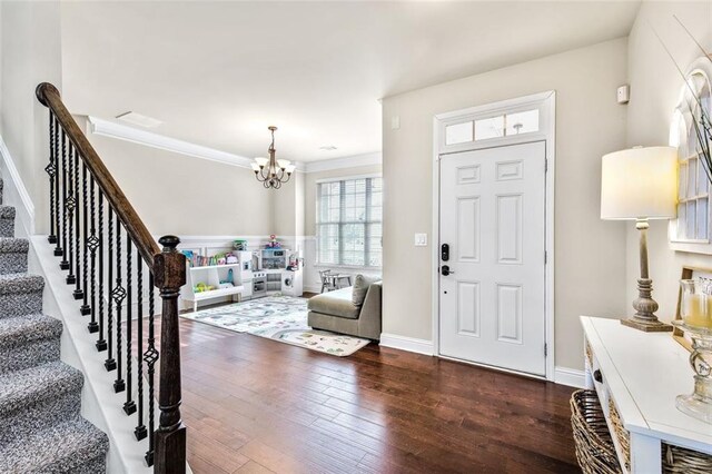 entrance foyer featuring a high ceiling, dark wood-type flooring, and ceiling fan