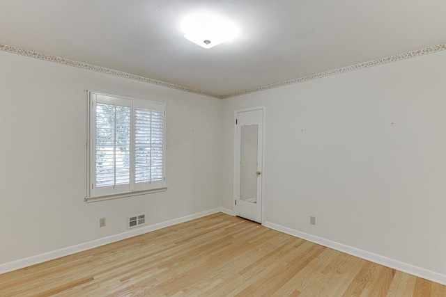 spare room featuring light hardwood / wood-style floors