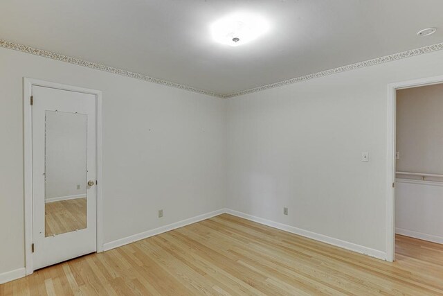 spare room with light wood-type flooring