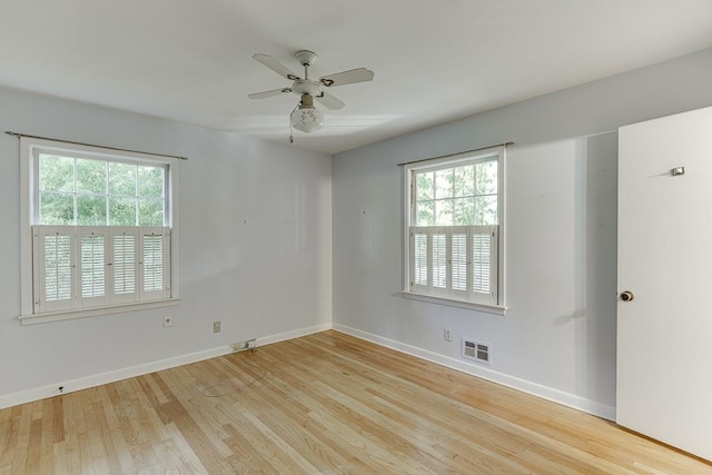 spare room featuring light hardwood / wood-style floors and ceiling fan