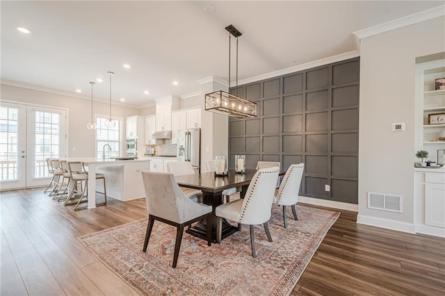 5005 Shay Town Ln, Peachtree Corners, GA 30092 - dining space featuring crown molding, recessed lighting, wood finished floors, and visible vents