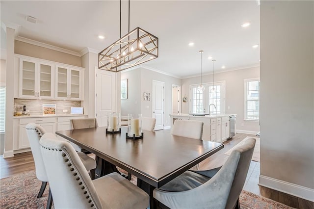 5005 Shay Town Ln, Peachtree Corners, GA 30092 - dining area featuring crown molding, baseboards, recessed lighting, and light wood-style flooring