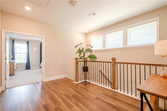 5005 Shay Town Ln, Peachtree Corners, GA 30092 - hall featuring visible vents, wood finished floors, baseboards, an upstairs landing, and recessed lighting