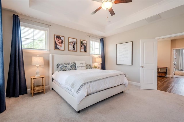 5005 Shay Town Ln, Peachtree Corners, GA 30092 - carpeted bedroom featuring a ceiling fan, a tray ceiling, visible vents, and baseboards
