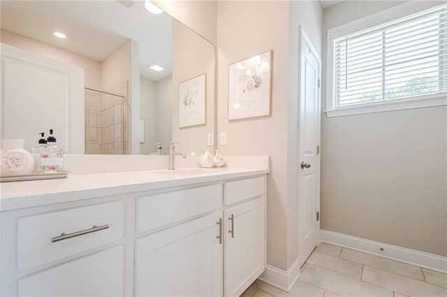 5005 Shay Town Ln, Peachtree Corners, GA 30092 - bathroom with vanity, baseboards, tile patterned flooring, and tiled shower