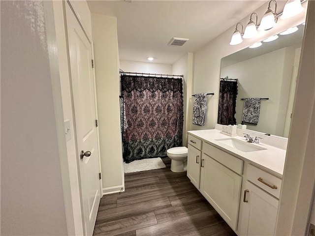 544 Magnolia Cir, Palmetto, GA 30268 - full bath featuring vanity, wood finished floors, a shower with shower curtain, and recessed lighting