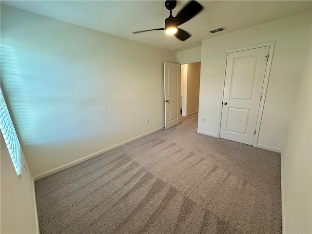 544 Magnolia Cir, Palmetto, GA 30268 - unfurnished bedroom featuring carpet flooring and ceiling fan