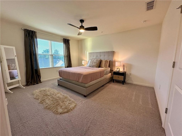 544 Magnolia Cir, Palmetto, GA 30268 - carpeted bedroom with baseboards and ceiling fan