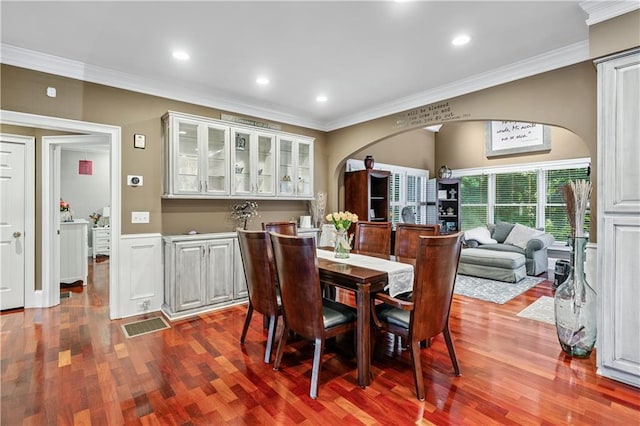 2012 Arbor Springs Way, Buford, GA 30519 - dining room featuring arched walkways, dark wood-style floors, crown molding, wainscoting, and recessed lighting