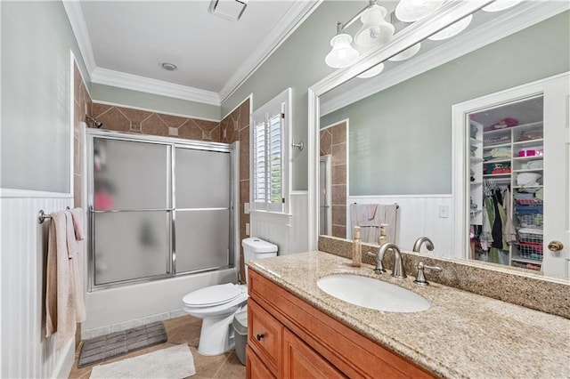 2012 Arbor Springs Way, Buford, GA 30519 - full bath featuring wainscoting, vanity, bath / shower combo with glass door, tile patterned floors, and crown molding