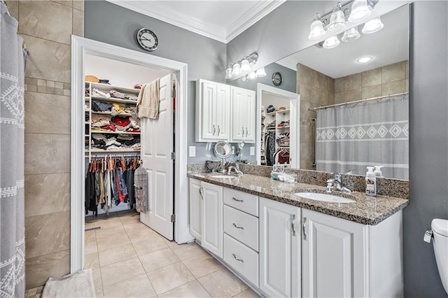 2012 Arbor Springs Way, Buford, GA 30519 - full bathroom featuring a spacious closet, ornamental molding, double vanity, tile patterned floors, and a tile shower