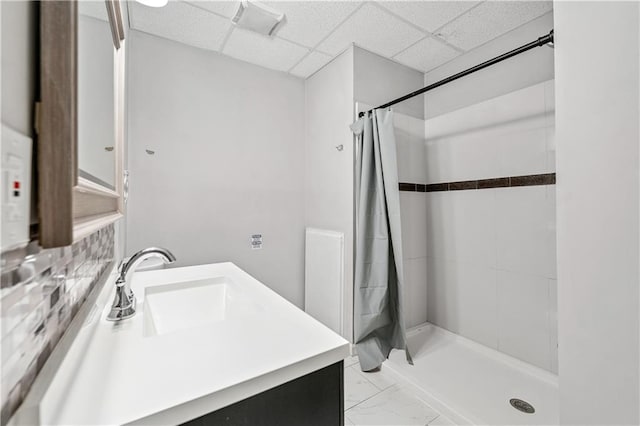 2012 Arbor Springs Way, Buford, GA 30519 - full bathroom featuring vanity, tiled shower, a paneled ceiling, and marble look tiles