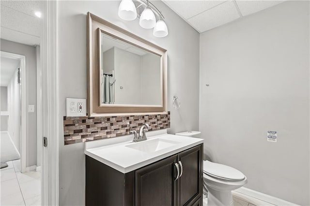 2012 Arbor Springs Way, Buford, GA 30519 - bathroom with vanity, backsplash, marble finish floors, and a drop ceiling