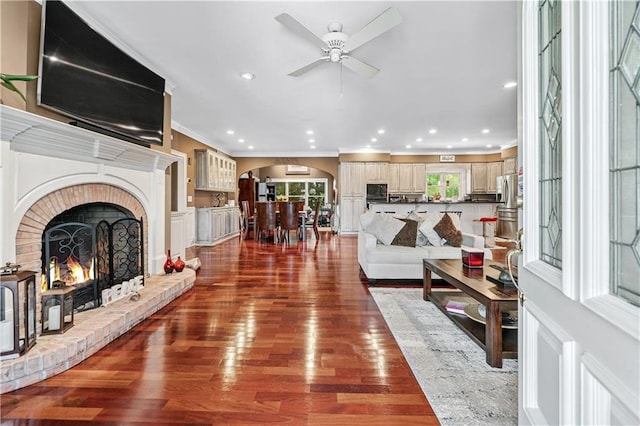 2012 Arbor Springs Way, Buford, GA 30519 - living room featuring arched walkways, crown molding, a ceiling fan, wood finished floors, and recessed lighting