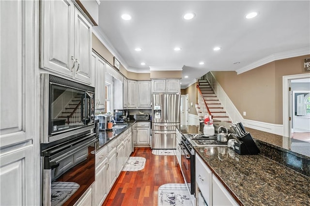 2012 Arbor Springs Way, Buford, GA 30519 - kitchen with stainless steel fridge, ornamental molding, black oven, built in microwave, and range