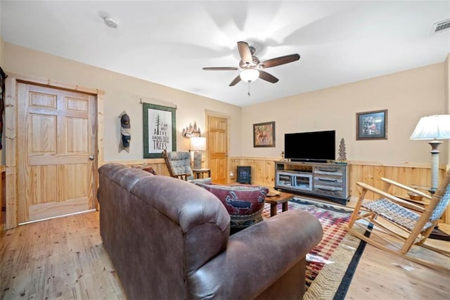 100 Julep Cir, Ellijay, GA 30540 - living area featuring light wood-style flooring, a wainscoted wall, a ceiling fan, and wooden walls