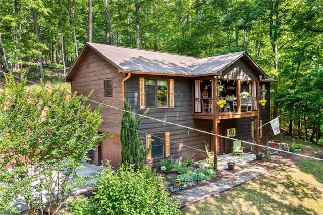 100 Julep Cir, Ellijay, GA 30540 - rustic home with an attached garage and a wooded view