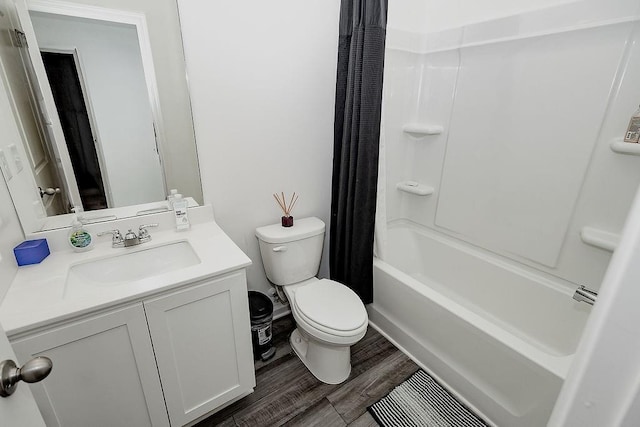 full bath featuring shower / tub combo with curtain, vanity, toilet, and wood finished floors