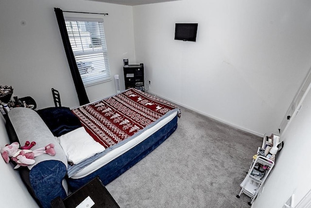 carpeted bedroom with baseboards