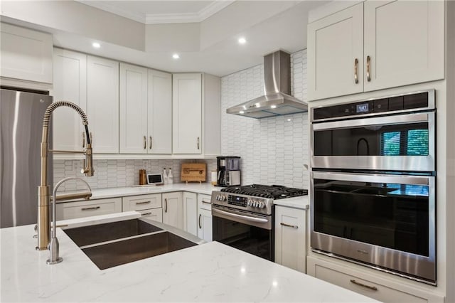 2721 Old Concord Rd SE, Smyrna, GA 30082 - kitchen featuring wall chimney range hood, appliances with stainless steel finishes, crown molding, tasteful backsplash, and light stone counters