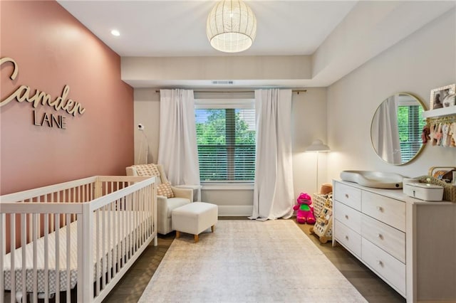 2721 Old Concord Rd SE, Smyrna, GA 30082 - bedroom with a nursery area, multiple windows, dark wood-type flooring, and recessed lighting